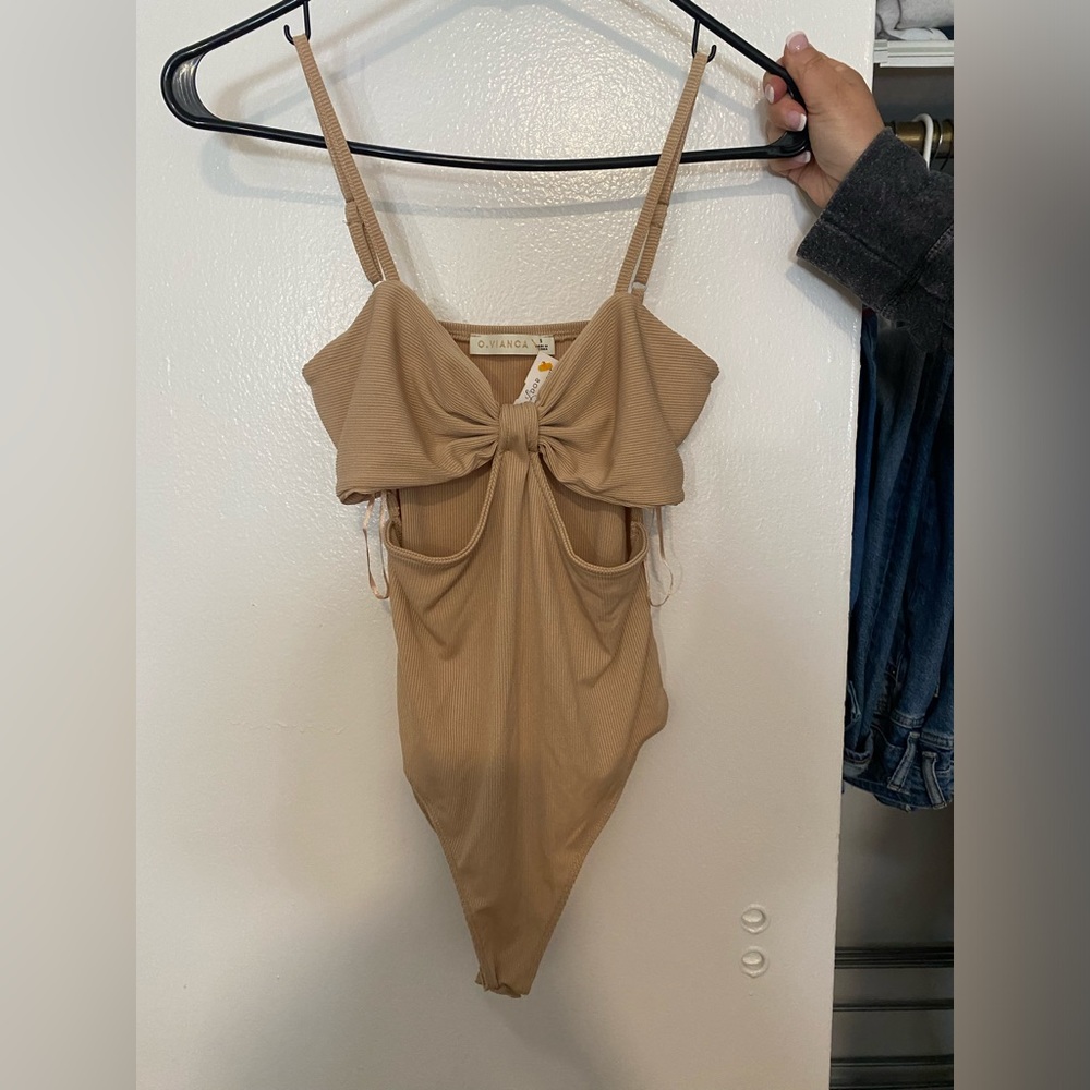 Nude bodysuit with cutouts and adjustable straps